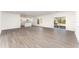 Open concept living and kitchen area with hardwood floors at 1609 Pickerel Ct, Kissimmee, FL 34759