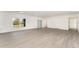 Bright and airy living room with vinyl plank flooring and sliding glass door at 1609 Pickerel Ct, Kissimmee, FL 34759