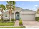 Curb appeal abounds at this charming one-story home with a two-car garage at 2271 Rush Bay Way, Orlando, FL 32824