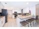 Modern kitchen with an island, white cabinets, and granite countertops at 237 Church St, Lake Helen, FL 32744