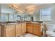 Double vanity bathroom with granite countertops at 2377 Victoria Dr, Davenport, FL 33837