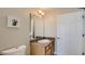 Clean bathroom with single vanity and granite countertop at 2377 Victoria Dr, Davenport, FL 33837