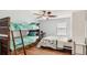Bedroom with full-size bed, bunk bed, and ceiling fan at 2377 Victoria Dr, Davenport, FL 33837