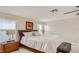 Spacious bedroom with a king-size bed, nightstands, and a bench at the foot of the bed at 2377 Victoria Dr, Davenport, FL 33837