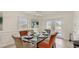 Dining room with glass table and access to the backyard at 2377 Victoria Dr, Davenport, FL 33837