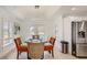 Bright dining area with glass table and access to backyard at 2377 Victoria Dr, Davenport, FL 33837