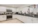 Spacious kitchen boasts stainless steel appliances and granite countertops at 2377 Victoria Dr, Davenport, FL 33837