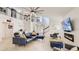 Open living space with sectional sofa, fireplace, and high ceilings at 2377 Victoria Dr, Davenport, FL 33837