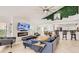 Open living area with a fireplace, large TV, and comfortable seating at 2377 Victoria Dr, Davenport, FL 33837