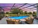 Inviting screened pool area with lounge chairs and sunset view at 2377 Victoria Dr, Davenport, FL 33837