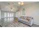 Living room with grey sofa and sliding glass doors at 264 Chicago W Ave, Haines City, FL 33844