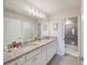 Double vanity bathroom with granite countertop and shower at 4250 Lana Ave, Davenport, FL 33897