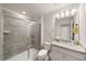 Bathroom with walk-in shower, granite countertop, and Minion decor at 4250 Lana Ave, Davenport, FL 33897