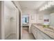 Bathroom with double vanity and view of bedroom at 4250 Lana Ave, Davenport, FL 33897