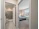Guest bedroom with ensuite bathroom and window with blinds at 4250 Lana Ave, Davenport, FL 33897