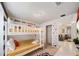bedroom with bunk beds and access to a closet and living room at 4250 Lana Ave, Davenport, FL 33897