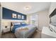 Bedroom with king-size bed, Minions wall art, and a TV at 4250 Lana Ave, Davenport, FL 33897