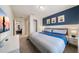 Bedroom with king-size bed, Minions wall art, and access to a living area at 4250 Lana Ave, Davenport, FL 33897