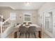 Bright dining room with table and chairs, and access to staircase at 4250 Lana Ave, Davenport, FL 33897