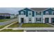 Two-story townhome with light blue exterior at 4250 Lana Ave, Davenport, FL 33897
