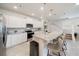 Kitchen with white cabinets, granite countertops and island at 4250 Lana Ave, Davenport, FL 33897