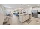 Modern kitchen with white cabinets, granite counters, and island at 4250 Lana Ave, Davenport, FL 33897