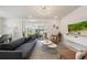 Spacious living room with large TV and sliding doors leading to the backyard at 4250 Lana Ave, Davenport, FL 33897