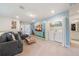 Multipurpose loft area with a comfortable couch and laundry area at 4250 Lana Ave, Davenport, FL 33897