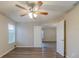 Bright bedroom with wood-look floors and ceiling fan at 5436 Wood Crossing St, Orlando, FL 32811