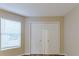 Bedroom with double door closet and window at 5436 Wood Crossing St, Orlando, FL 32811
