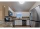 Modern kitchen with stainless steel appliances and granite counters at 5436 Wood Crossing St, Orlando, FL 32811