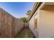 Side yard with wooden fence and stone pathway at 5436 Wood Crossing St, Orlando, FL 32811