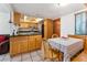 Kitchen with light wood cabinets, granite countertops, and stainless steel appliances at 5509 Bay Lagoon Cir, Orlando, FL 32819