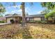 Front exterior of single-Gathering home with attached garage and landscaping at 5628 Baybrook Ave, Orlando, FL 32819