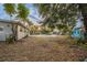 Large backyard with mature trees, providing ample space at 5815 Harrington Dr, Orlando, FL 32808