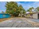 Large backyard with mature trees, providing ample space at 5815 Harrington Dr, Orlando, FL 32808