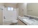 Bathroom with granite countertop and white bathtub at 5815 Harrington Dr, Orlando, FL 32808