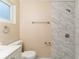 Bathroom with marble-tiled shower and white vanity at 5815 Harrington Dr, Orlando, FL 32808