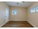 Bright bedroom with wood-look floors and ceiling fan at 5815 Harrington Dr, Orlando, FL 32808