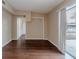 Living room with dark wood floors and sliding glass door at 5815 Harrington Dr, Orlando, FL 32808