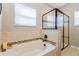 Spa-like bathroom with soaking tub and walk-in shower at 705 Walkers Grove Ln, Winter Garden, FL 34787