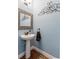 Small, updated powder room with pedestal sink at 705 Walkers Grove Ln, Winter Garden, FL 34787