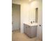 Modern bathroom with gray vanity, white countertop, and tiled floor at 7493 Estuary Lake Loop, Kissimmee, FL 34747