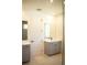Modern bathroom with double vanity and gray cabinets at 7493 Estuary Lake Loop, Kissimmee, FL 34747