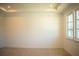 Spacious bedroom with neutral walls and carpet, featuring large windows at 7493 Estuary Lake Loop, Kissimmee, FL 34747