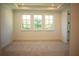 Large bedroom with three windows and neutral carpet at 7493 Estuary Lake Loop, Kissimmee, FL 34747