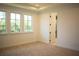 Spacious bedroom with access to en-suite bathroom and hallway at 7493 Estuary Lake Loop, Kissimmee, FL 34747