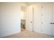 Spacious bedroom with carpeting and access to hallway at 7493 Estuary Lake Loop, Kissimmee, FL 34747