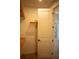 Walk-in closet with wooden shelving and hanging rods at 7493 Estuary Lake Loop, Kissimmee, FL 34747