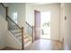 Spacious entryway with open door revealing a view of the street at 7493 Estuary Lake Loop, Kissimmee, FL 34747